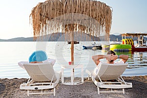 Holidays under parasol in Greece