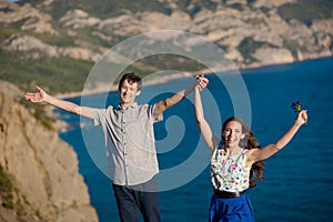 Holidays, vacation, love and people concept - happy smiling teenage couple having fun at summer park