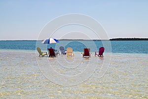 Holidays vacation symbolic seascape, deck chairs and sun umbrella Florida Keys