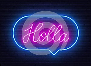 Holla neon sign in the speech bubble on brick wall background.