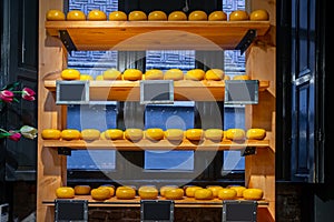 Holland cheese wheels on the shelves in diary production market