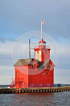 Holland Harbor Light Big Red lighthouse on lake Michigan MI against morning sky