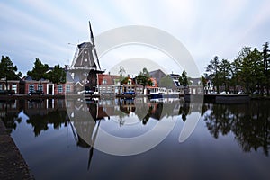 Holland - Meppel - a windmill in the middle of the town of Meppel, standing on the edge of a canal. The mill stands between