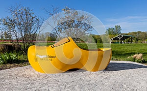 HOLLAND, MICHIGAN - MAY 13, 2022: Large shoe in display at the Veldheer Tulip Gardens on May 13, 2015 in Holland, Michigan