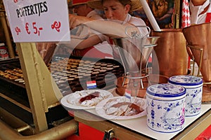 Holland Netherlands Alkmaar Dutch Lady Traditional Costume Dress Cheese Market Sweet Snack Poffertjes Mini Pancakes Waagplein