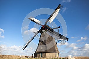 Holland windmill. Old mill chalk and flour . The beautiful backdrop of the countryside of Holland.