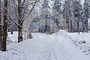 Hollola city buildings along the snow-covered road, Finland.