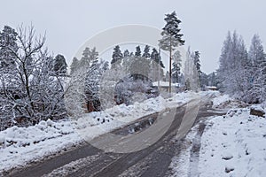 Hollola city buildings along the snow-covered road, Finland.