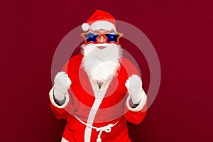 Holly jolly x-mas, confidence, magic, triumph concept. Cool funny playful biddle aged man shows win gesture