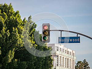 Hollywood Blvd street sign on traffic light at intersection at Los Angeles