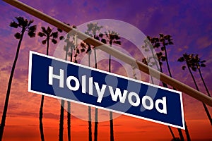 Hollywood California road sign on redlight with pam trees photo photo