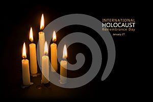 Holocaust Remembrance Day, January 27, candles against black background photo