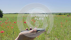 Hologram of Business plan on a smartphone