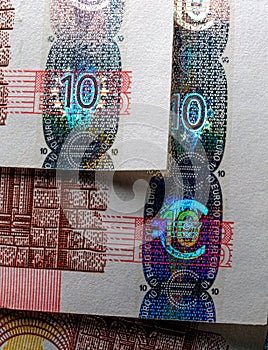 Hologram - Money euro currency seal, temper-proof counterfeits authenticity protection against forgery of euro macro