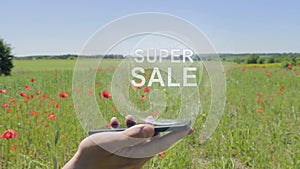 Hologram of Super sale on a smartphone