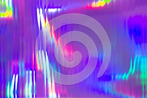 Holographic abstract background. Rainbow neon glass texture pattern. Trendy colorful reeded refract effect