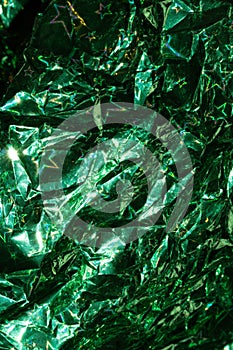 Holographic Crumpled Green Paper Material which is Shiny for Background