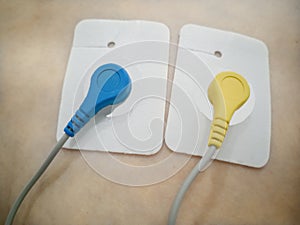 Holter monitoring. 24-hour ECG recording. Blue and yellow Holter sensors - heart with Ukraine