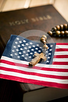 Holy bible with american flag and crucifix