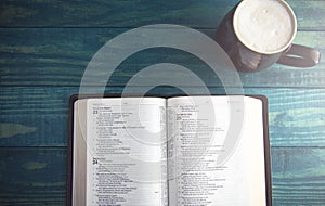 Holy Bible on a Blue Wooden Table