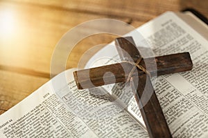 Holy Bible book and cross, close-up view