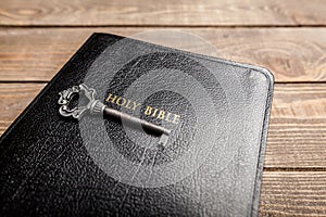 Holy Bible book on wooden background