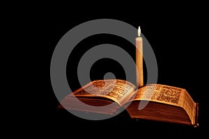 Holy Bible with candle