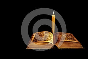 Holy Bible with candle