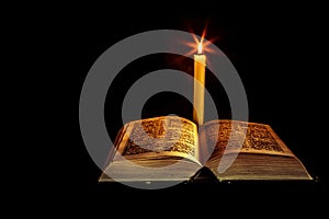 Holy Bible with candle