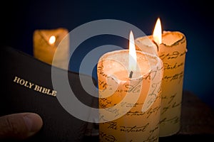 Holy bible by candlelight