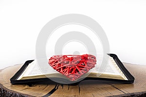 Holy Bible. Easter - Christ. Open bible on the table. Prayer. Resurrected resurrection. Red heart, God`s love concept.