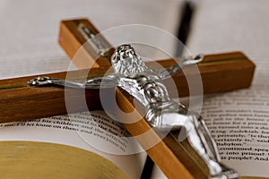 The Holy Bible on a Holy Cross of Jesus on way to God through prayer