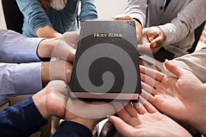 Hands Holding Holy Bible