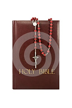 Holy bible with rosary.