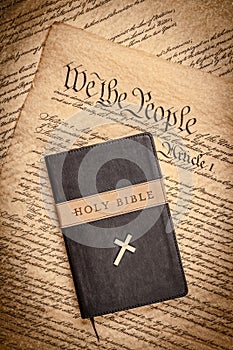 Holy bible and small cross on the constitution