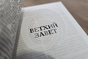 Holy Bible on the white table. concept of faith and religion. christian faith. The inscription on the book translated from Russian