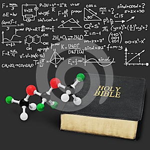 Holy bible book and chemistry form on dark