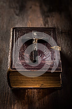 Holy bible with wooden cross