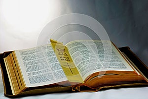 Holy Bible; Word of God with page marker.