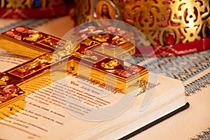 Holy book bible and golden cross in a church in Ukraine, prayer and faith, religion