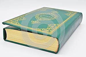 The Holy Book of Muslims, the Qur`an book green. photo