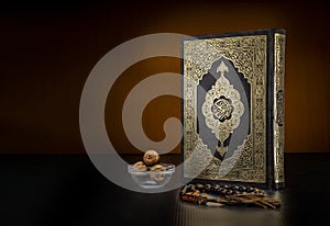 Holy Book of Quran With Rosary and Dates