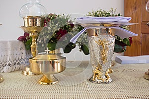 Holy communion chalice on wooden table