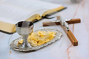 The holy communion of Christians consists of unleavened bread, chalice wine, and other signs and symbols of Jesus Christ