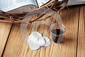 Holy Communion, a Cup of Wine and Bread with a Jesus Crown Thorn and Holy Bible