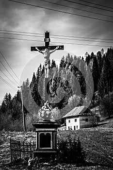 The Holy Cross in front of forest in the valley to Utekac city of Slovakia