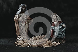 The holy family on a dark gray surface