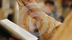 Holy Father blessing and crossing parishioners at religious service in church