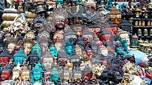 Figurines of Tara, Buddha, Ganesha, Garuda and other deities of Hinduism and Buddhism, made of resin and metal on a market counter