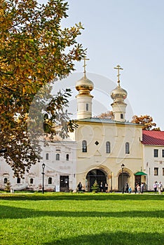 Holy gates of the Tikhvin Assumption Monastery in autumn